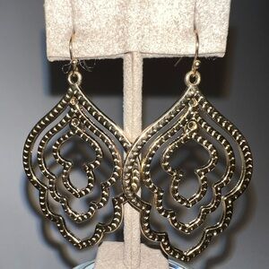 Gold colored dangle earrings